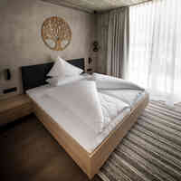 Glanzer Homes Längenfeld Zentrum Schlafzimmer gemiatliche Suite